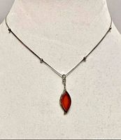 Necklace on display bust showing overall appearance and pendant drop