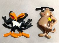 Front view of both magnets showing character details