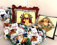 Group shot of four cat throw pillows