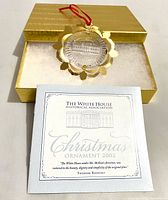 Ornament, box, and brochure grouped