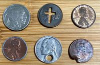 Fronts of six modified coins