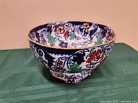Side view of multicolour floral ceramic footed bowl