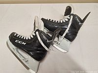 Side view of both skates showing overall condition