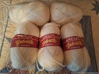 Four full skeins and one partial skein with labels visible