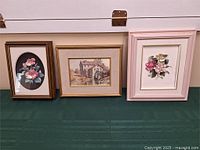Overall view of three framed artworks