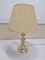 Full view of lamp with shade attached, showing overall style and finish