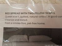 printed sheet showing listing details and quilted surface