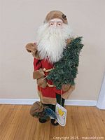 Full view of 41" Santa figure holding tree and sack