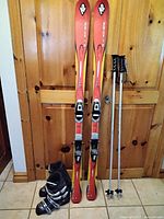 Full set showing skis, boots and poles