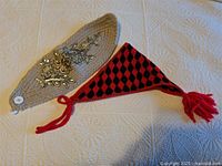 Hat and headband laid flat on surface