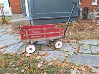 Full view of red Sears Estate Wagon on stone path