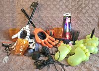 Overview of all items including yard lights, grabbers, tumblers, power adapters, keychain and LED stick