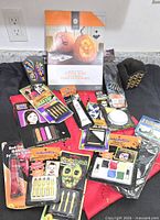 Group shot of all sealed Halloween makeup items, stencil book and accessories