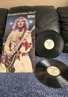 Front gatefold sleeve beside both LPs