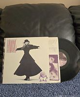 Front of jacket with record partially pulled out