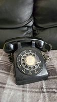 Front view of black rotary telephone