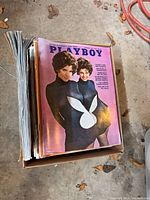 Box of magazines with Playboy issue on top