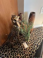 Cheetah sculpture, two vases and faux florals together