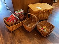 All baskets and tins grouped on floor