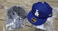 Two New Era 59Fifty LA Dodgers hats; grey sealed, blue displayed