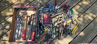 Overview of entire lot showing box of wrenches, hammer, files, wire brush and loose tools spread on deck