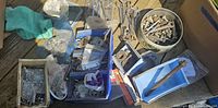 Overview of bins, boxes and assorted hardware fasteners and tools