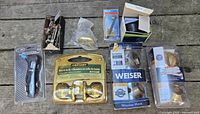 Overview of all packaged and loose hardware on wooden surface
