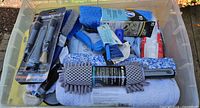 Top view of bin showing brushes, wash mitts, foam cannon box, microfiber towel