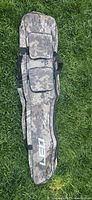 Full view of camo soft rifle case on grass