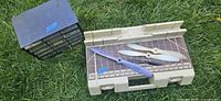 Drawer cabinet and Black & Decker case with propellers on grass