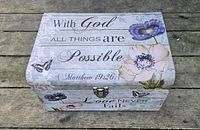 Closed decorative storage box exterior showing printed design and latch
