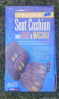 Front of the box showing product image and features of ObusForme Deluxe Seat Cushion with Heat & Massage