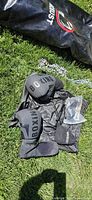 Close view boxing gloves, jump rope, chains, carry bag