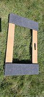 Top view of wood dolly showing carpeted ends