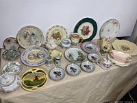 Assorted vintage chinaware arranged on table