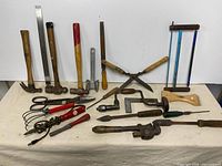 Overview of assorted vintage tools laid out on cloth