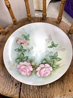 Front view showing hand painted pink roses and overall design