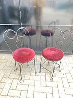 Pair of wrought iron chairs front view