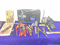 Overall view of tool lot showing pouch, soldering iron, pliers set, hand tools and accessories