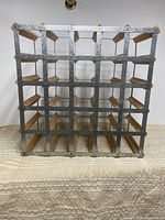 Front view of square 5×5 wine rack showing steel lattice and wood slats