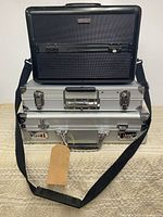 Stacked view of all three cases showing sizes, handles, straps and locks