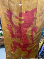 Full view of banner showing red lion rampant on gold background
