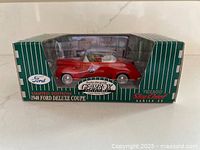 Front angled view of boxed red 1940 Ford Deluxe Coupe model