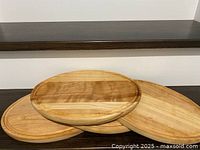 Three boards stacked showing top surfaces and groove