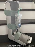 Full side view of FoamWalker boot showing straps and attached pump bag