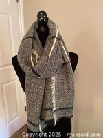 Scarf draped on mannequin showing overall size and drape