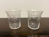 Front view of both etched crystal glasses