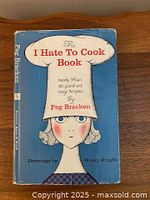 Front cover showing title, author, illustration, overall wear