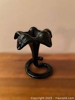 Front view of black handblown lily bud vase