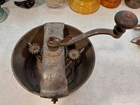 Top view showing crank handle, gears, and paddles inside pot